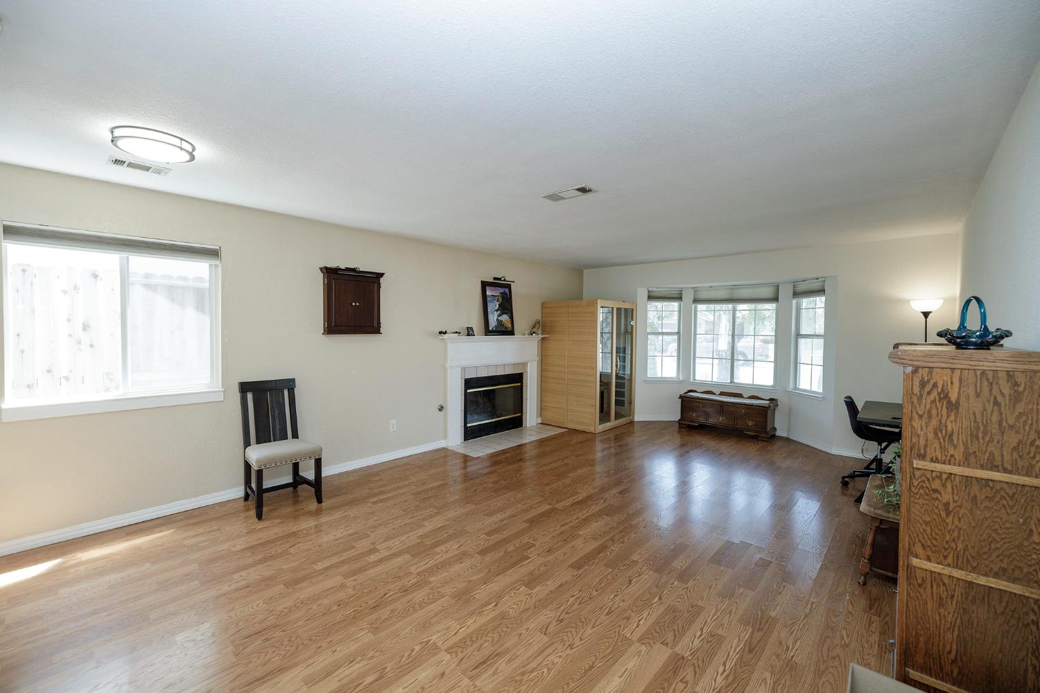 230 Meyenberg Avenue Ripon, CA 95366 - Photo 9 of 52 a view of livingroom with furniture wooden floor and windows