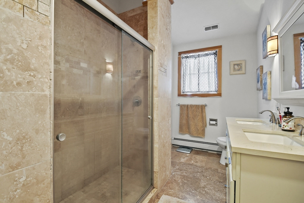 235 Wallace Hill Road Townsend, MA 01469 - Photo 33 of 42 a bathroom with a sink toilet and shower