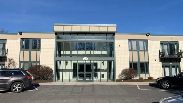 a view of a car parked in front of a building