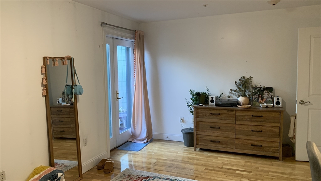 25 Alpine Street, Unit 10 Boston, MA 02136 - Photo 11 of 18 a room with a dresser