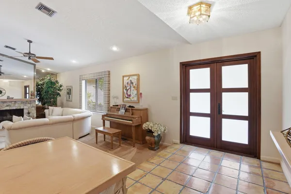 a living room with furniture and a large window