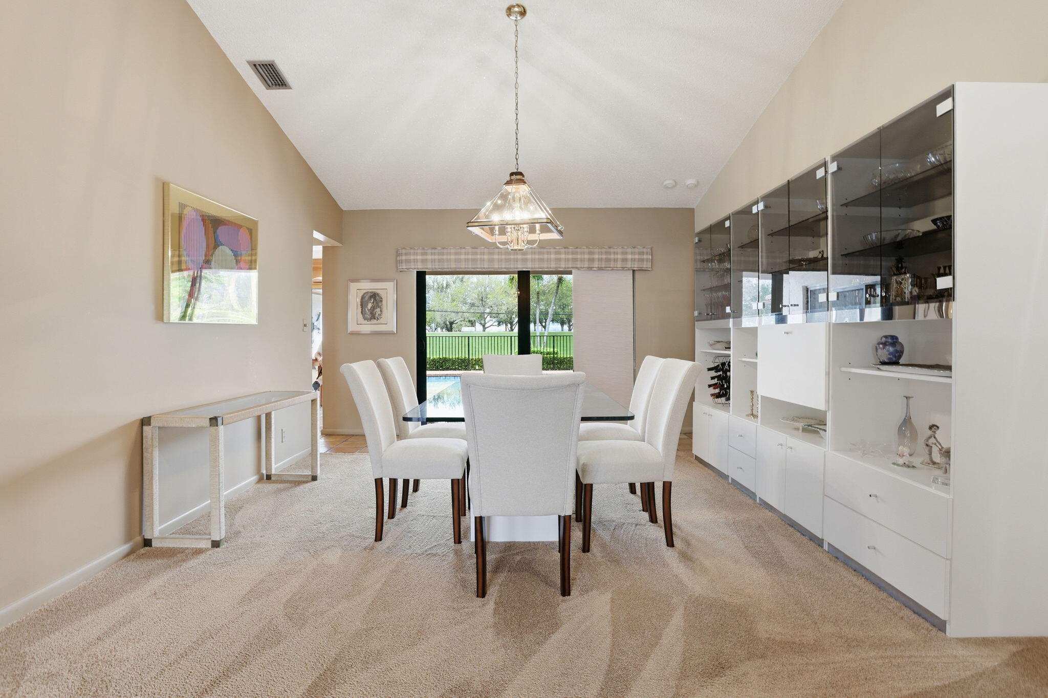 1960 Northwest 25th Street Boca Raton, FL 33431 - Photo 17 of 50 a dining room with furniture a chandelier and window