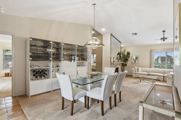 a dining room with furniture and window