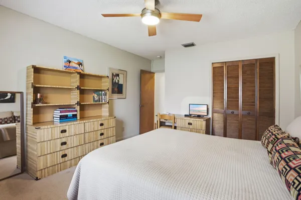a bedroom with a bed and a cabinets
