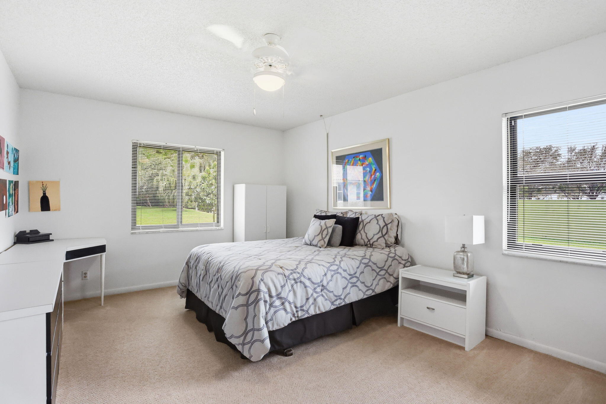 1960 Northwest 25th Street Boca Raton, FL 33431 - Photo 39 of 50 a bedroom with a bed and a window
