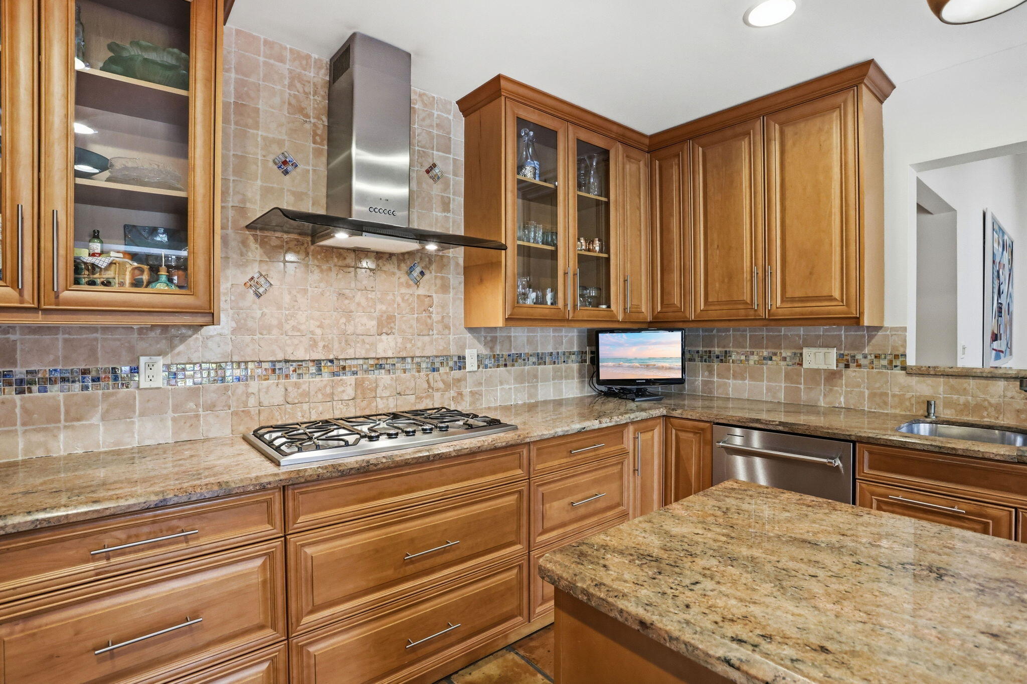 1960 Northwest 25th Street Boca Raton, FL 33431 - Photo 6 of 50 a kitchen with stainless steel appliances granite countertop a sink stove and cabinets