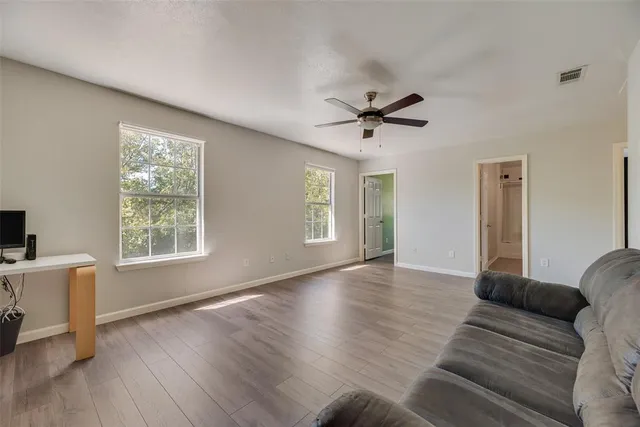 a living room with furniture and a window