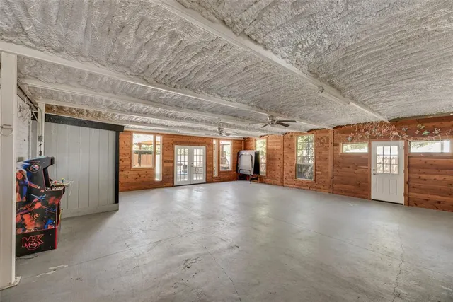 a view of an empty room with windows