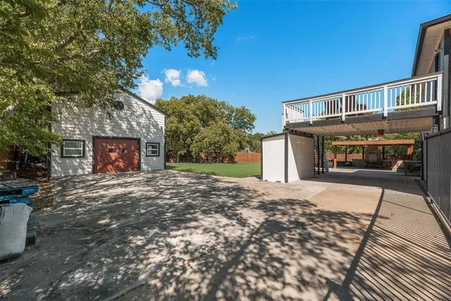 a view of a house with a yard and garage