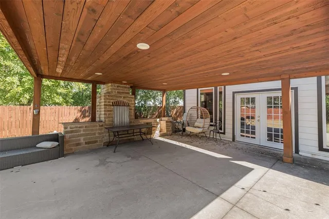 a room with furniture and a large window