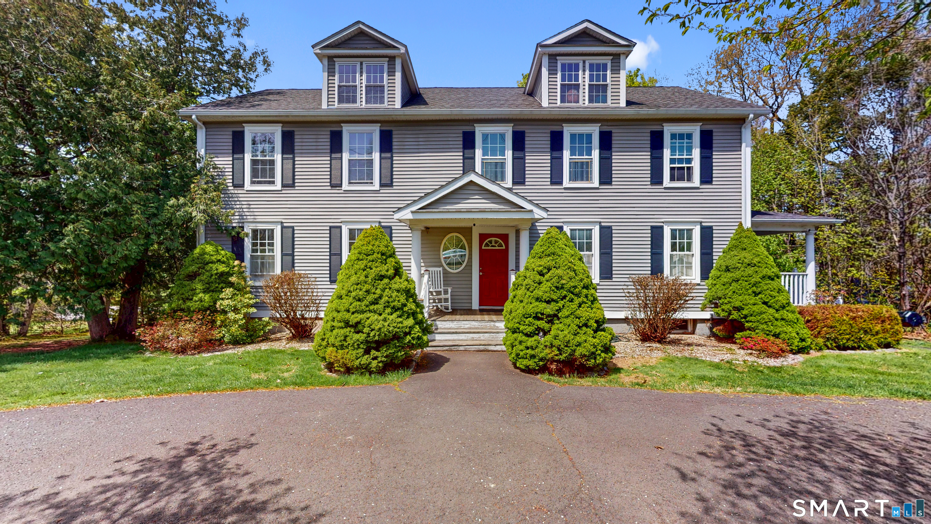 a front view of a house with a yard
