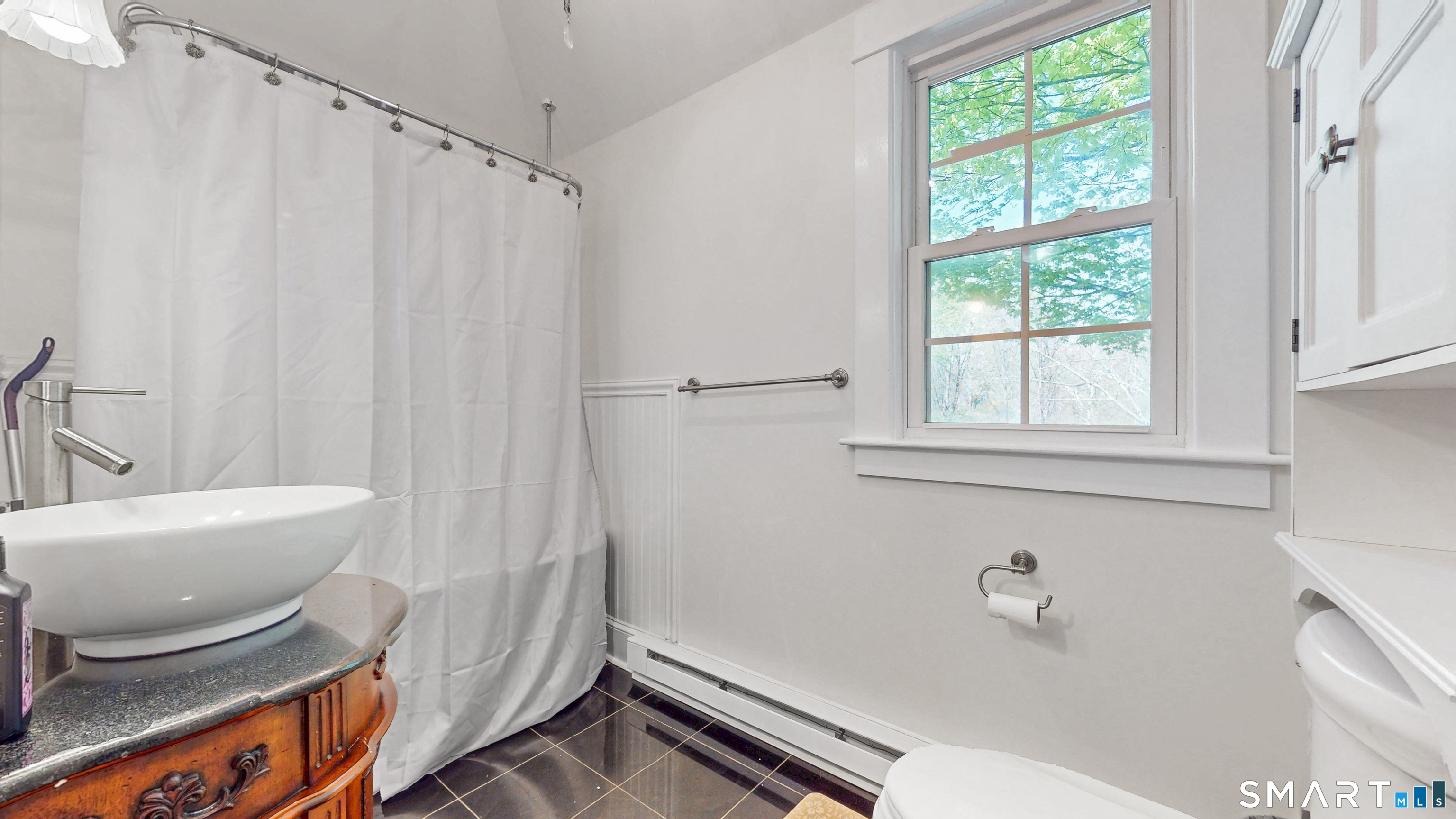 40 Middlefield Street Middletown, CT 06457 - Photo 12 of 38 a bathroom with a sink and a bathtub