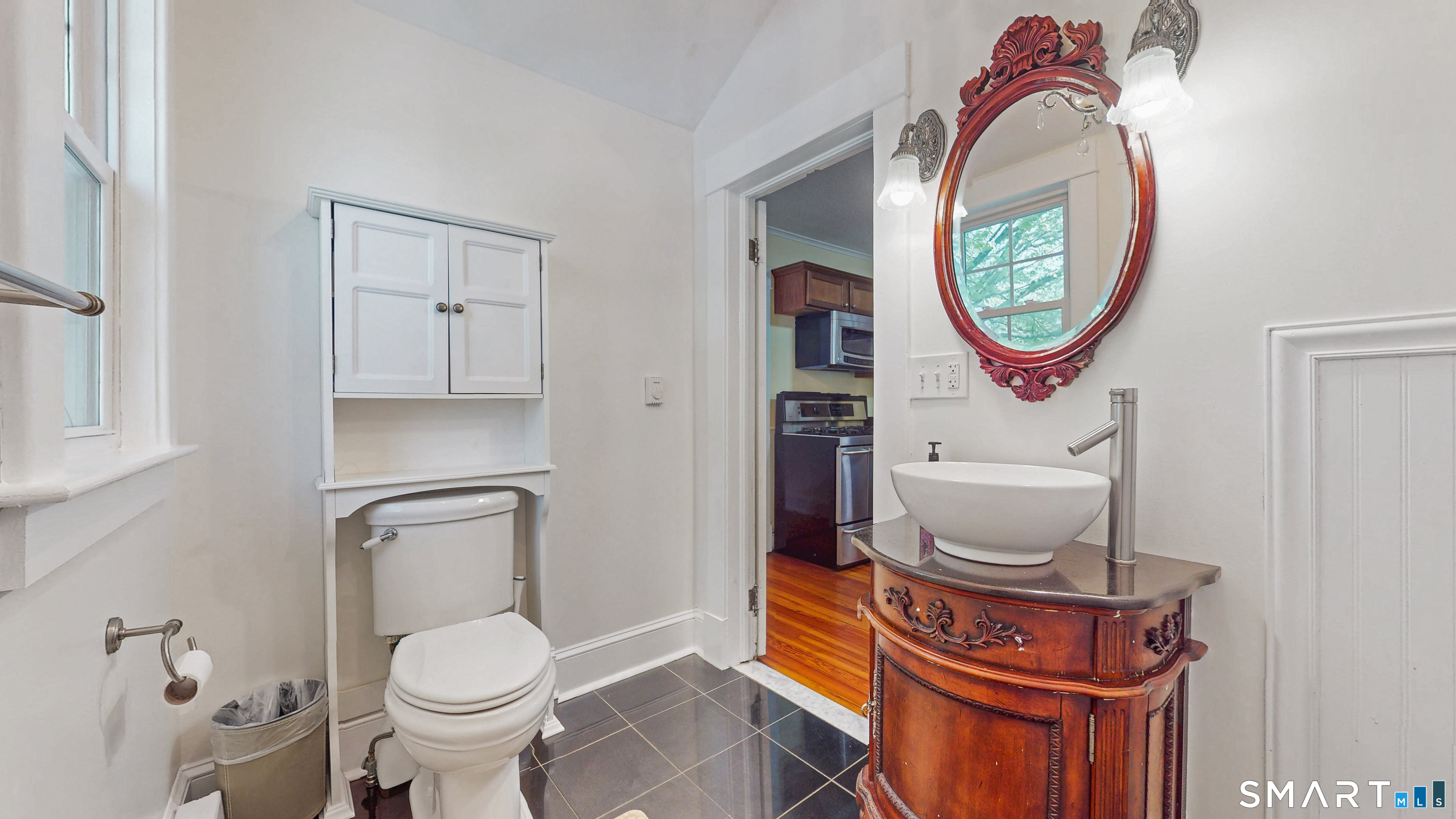 40 Middlefield Street Middletown, CT 06457 - Photo 13 of 38 a bathroom with a toilet a sink and a mirror