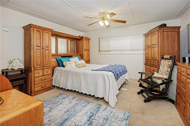 a bedroom with a bed and furniture