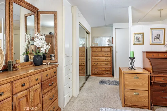 a kitchen with a refrigerator and cabinets