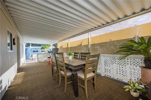 a patio with table and chairs