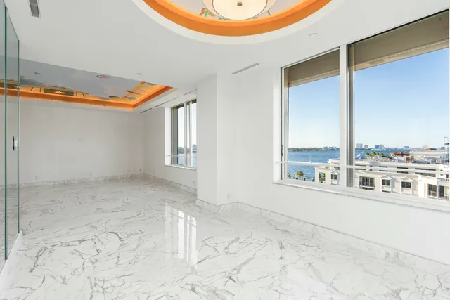 a bedroom with furniture and a lamp