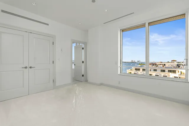 a spacious bathroom with a granite countertop sink mirror and a