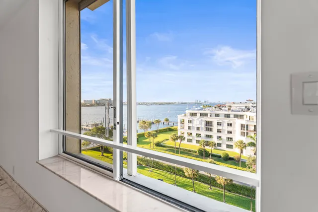 a view of a living room with a large window