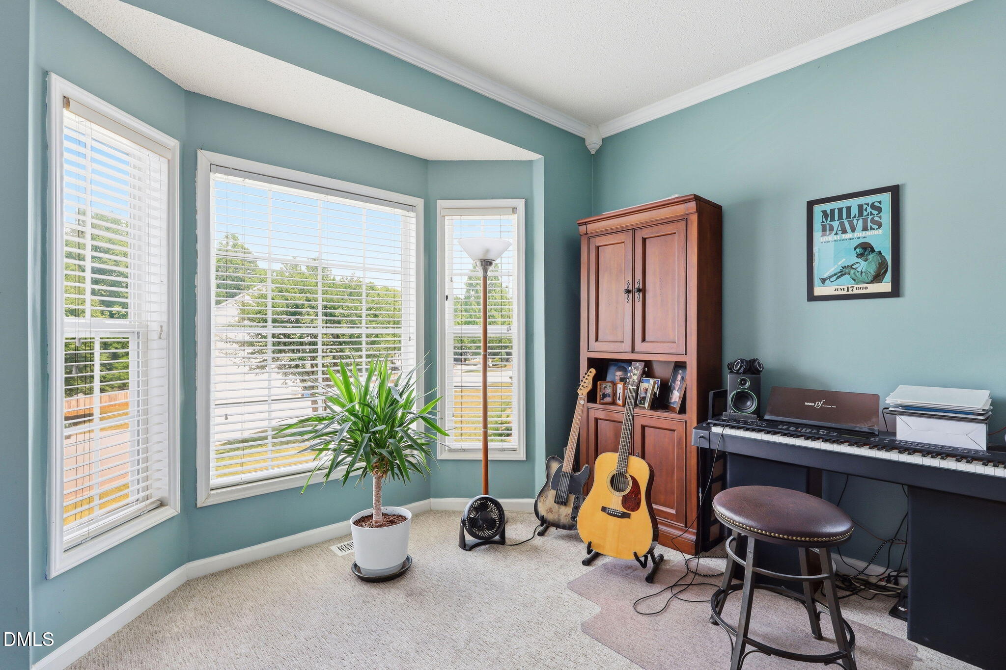 9105 Willow Valley Court Raleigh, NC 27617 - Photo 4 of 51 a room with furniture and a window