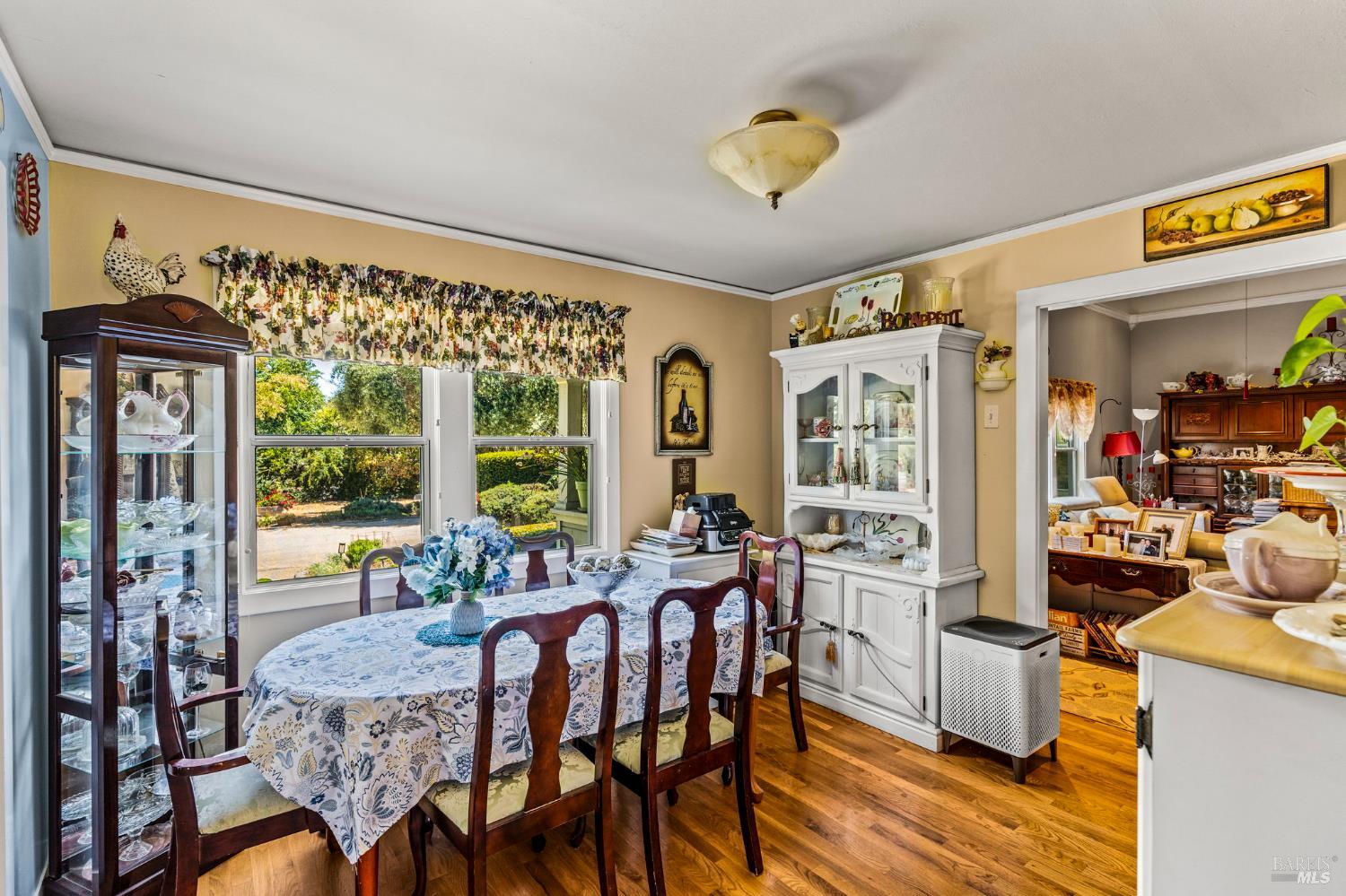 1225 Oakville Grade Road Oakville, CA 94558 - Photo 12 of 76 a view of a dining room with furniture a chandelier and wooden floor