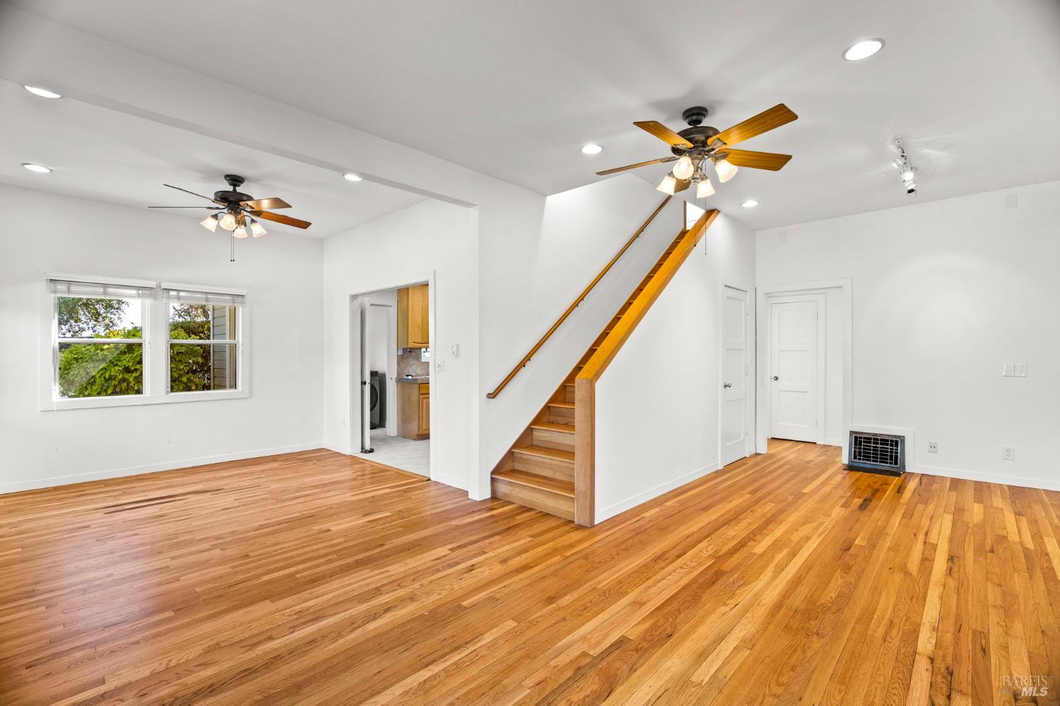 1225 Oakville Grade Road Oakville, CA 94558 - Photo 26 of 76 a view of an empty room with wooden floor and a ceiling fan