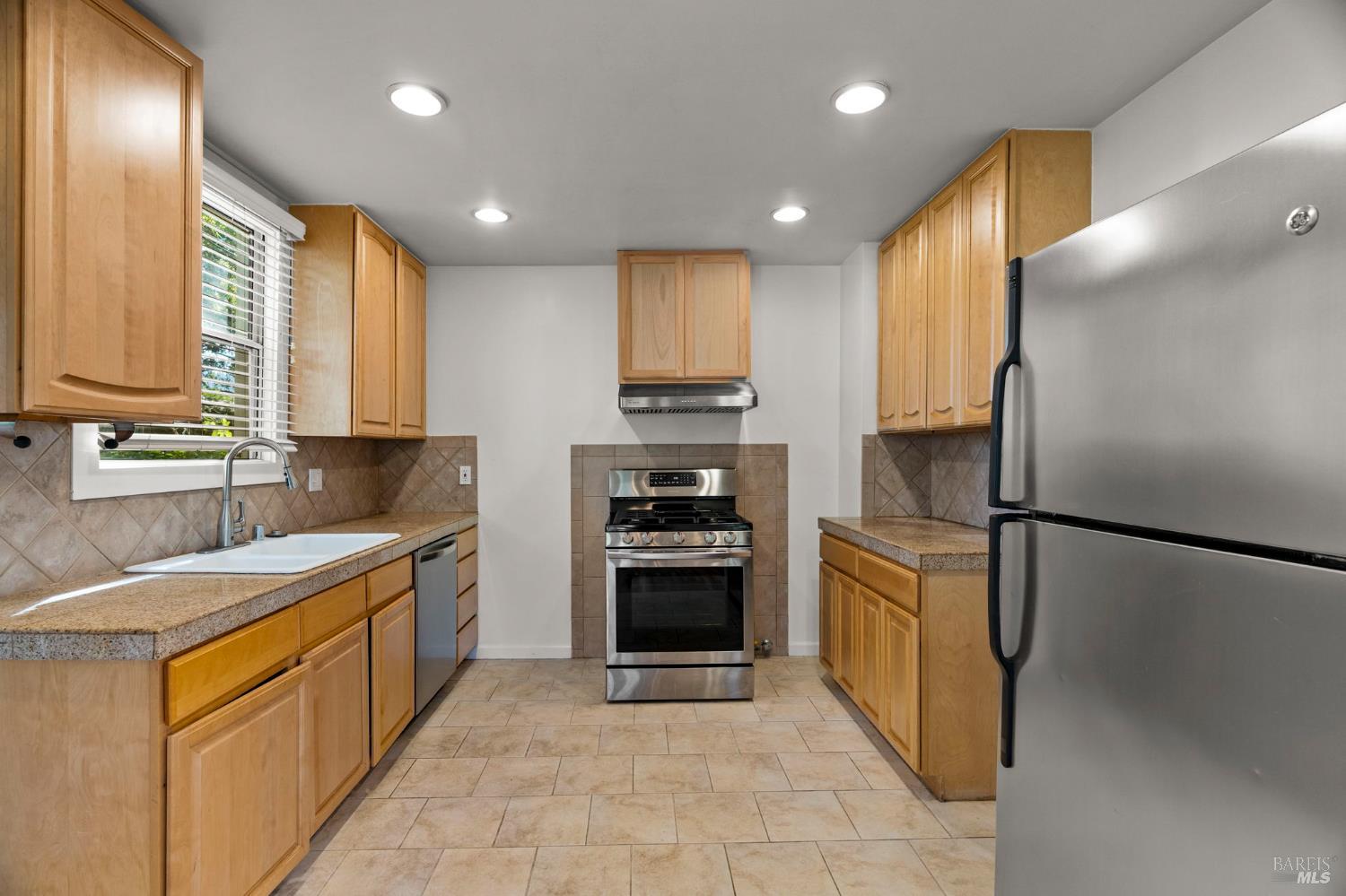 1225 Oakville Grade Road Oakville, CA 94558 - Photo 29 of 76 a kitchen with stainless steel appliances granite countertop a stove a refrigerator and a sink