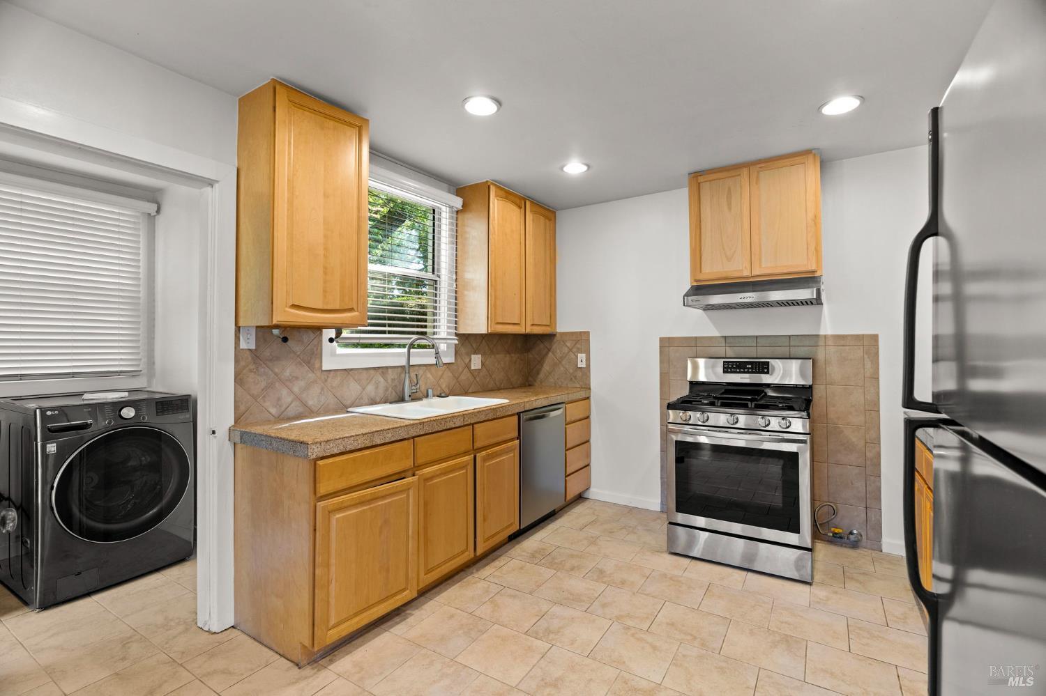 1225 Oakville Grade Road Oakville, CA 94558 - Photo 31 of 76 a kitchen with a sink stainless steel appliances and cabinets