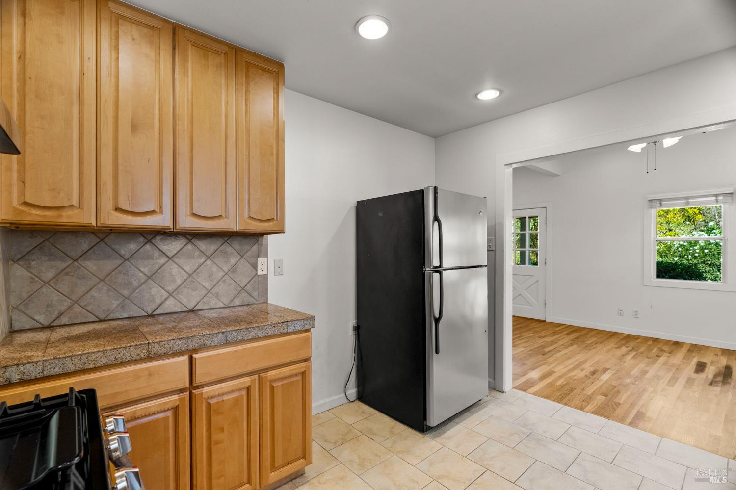 1225 Oakville Grade Road Oakville, CA 94558 - Photo 34 of 76 a kitchen with stainless steel appliances granite countertop a refrigerator and a sink