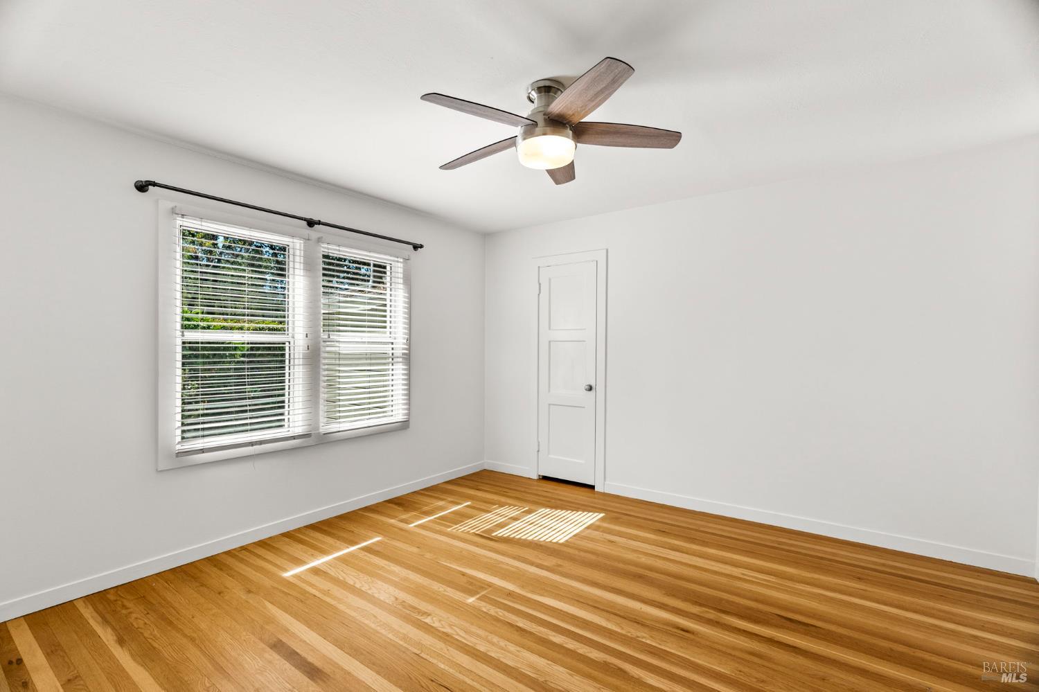 1225 Oakville Grade Road Oakville, CA 94558 - Photo 37 of 76 a view of a room with wooden floor and a ceiling fan
