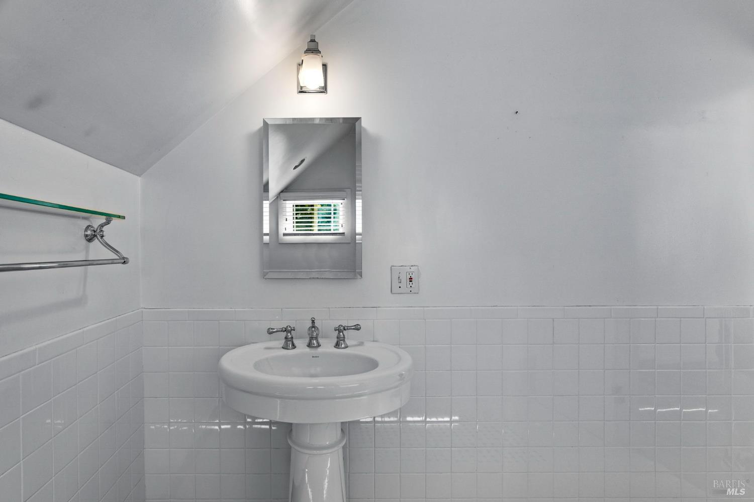 1225 Oakville Grade Road Oakville, CA 94558 - Photo 46 of 76 a bathroom with a sink and a mirror