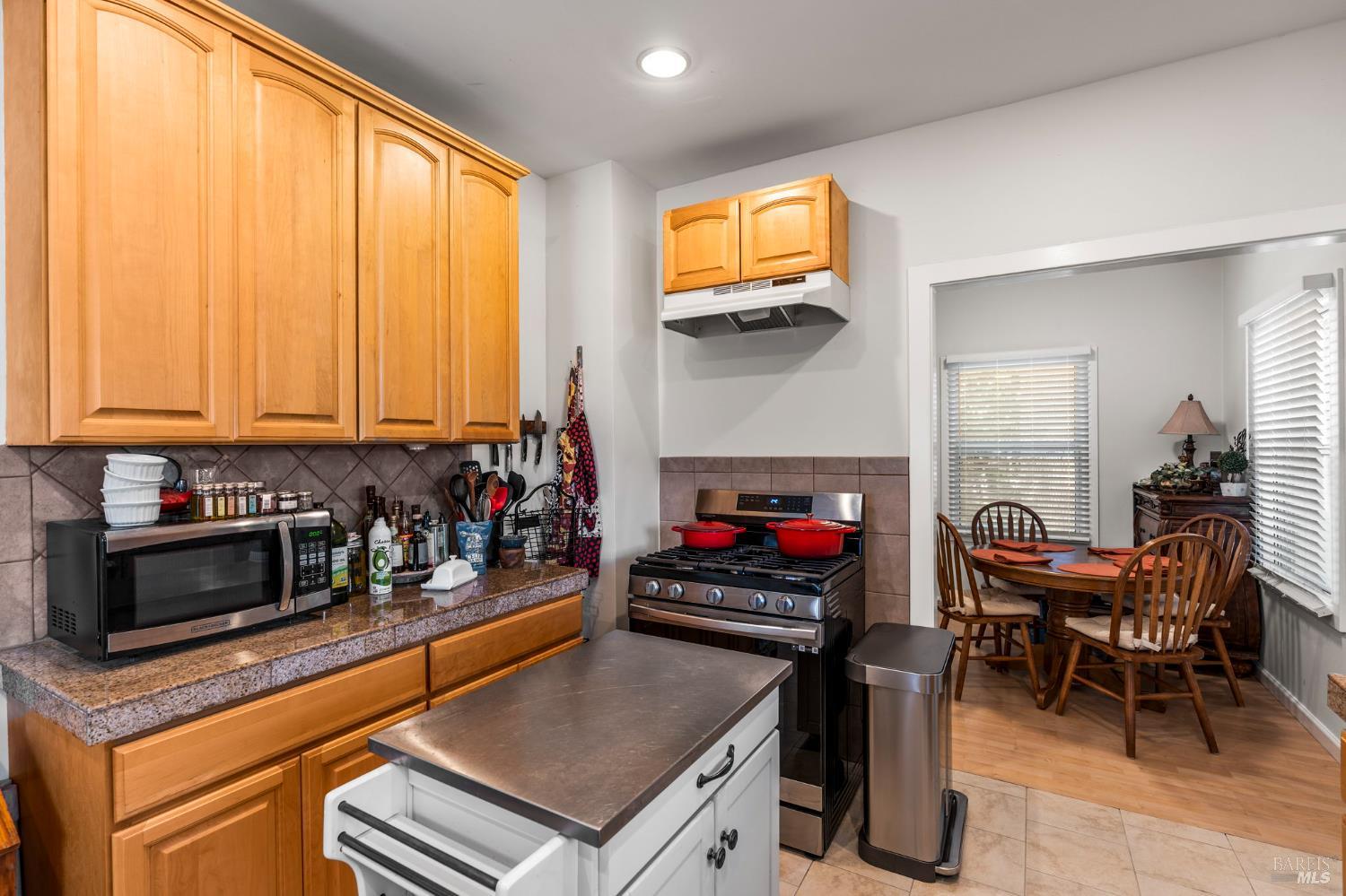 1225 Oakville Grade Road Oakville, CA 94558 - Photo 59 of 76 a kitchen with stainless steel appliances a stove a sink and a microwave