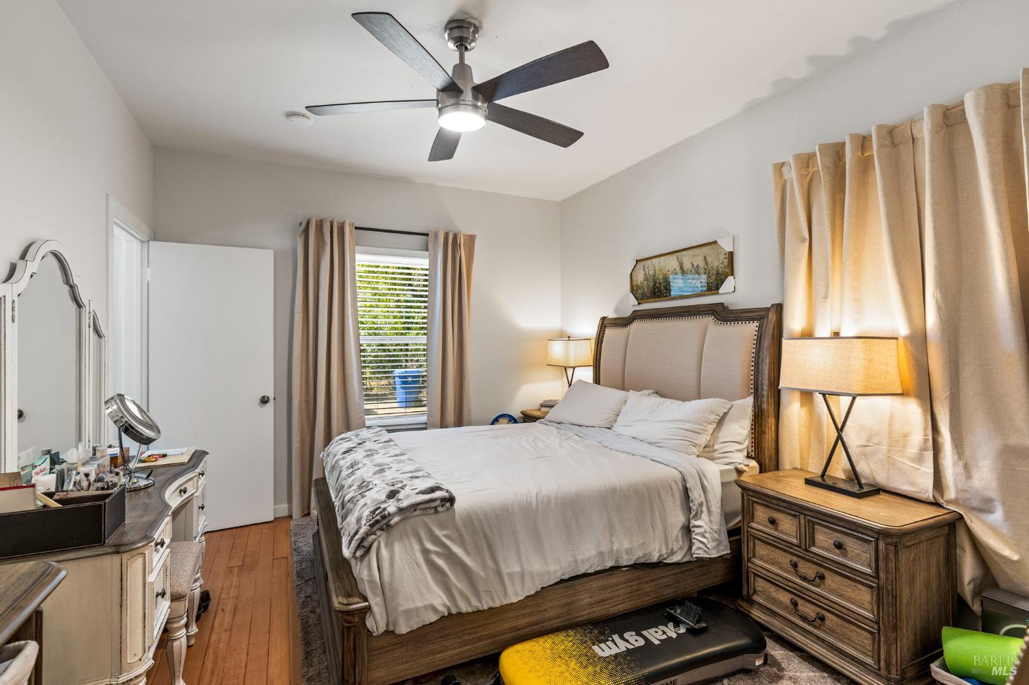 1225 Oakville Grade Road Oakville, CA 94558 - Photo 63 of 76 a bedroom with a bed and a chandelier