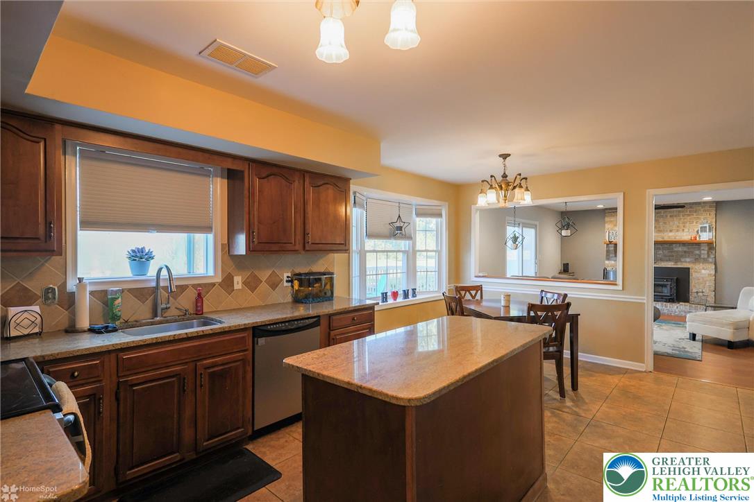 3657 Gramercy Place Bethlehem, PA 18020 - Photo 24 of 86 a kitchen with a sink a counter top space and living room area