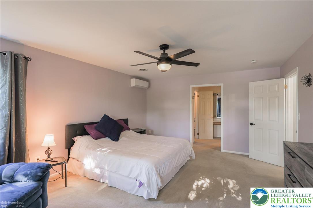 3657 Gramercy Place Bethlehem, PA 18020 - Photo 32 of 86 a bedroom with a bed and a chandelier