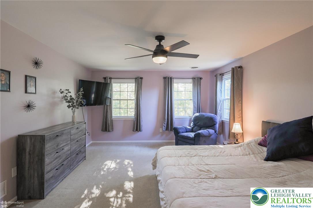 3657 Gramercy Place Bethlehem, PA 18020 - Photo 36 of 86 a bedroom with a large bed and ceiling fan