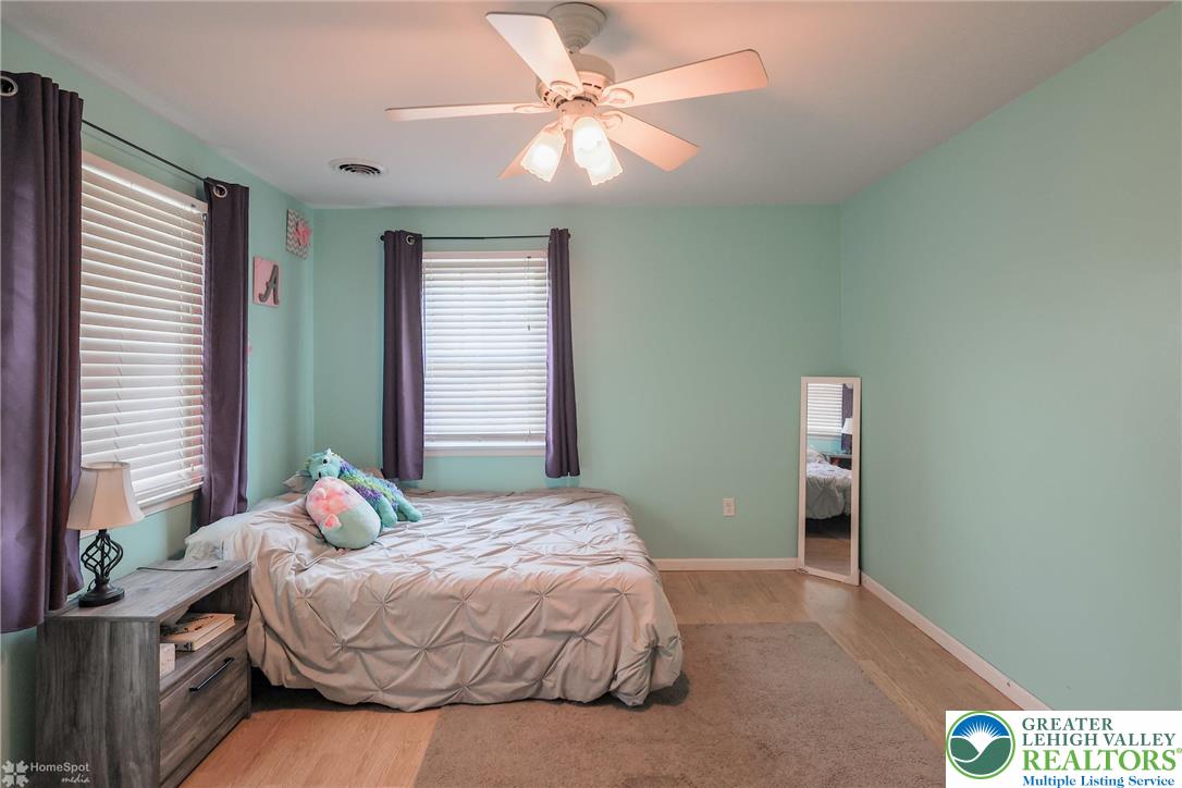 3657 Gramercy Place Bethlehem, PA 18020 - Photo 49 of 86 a bedroom with a bed and a chandelier