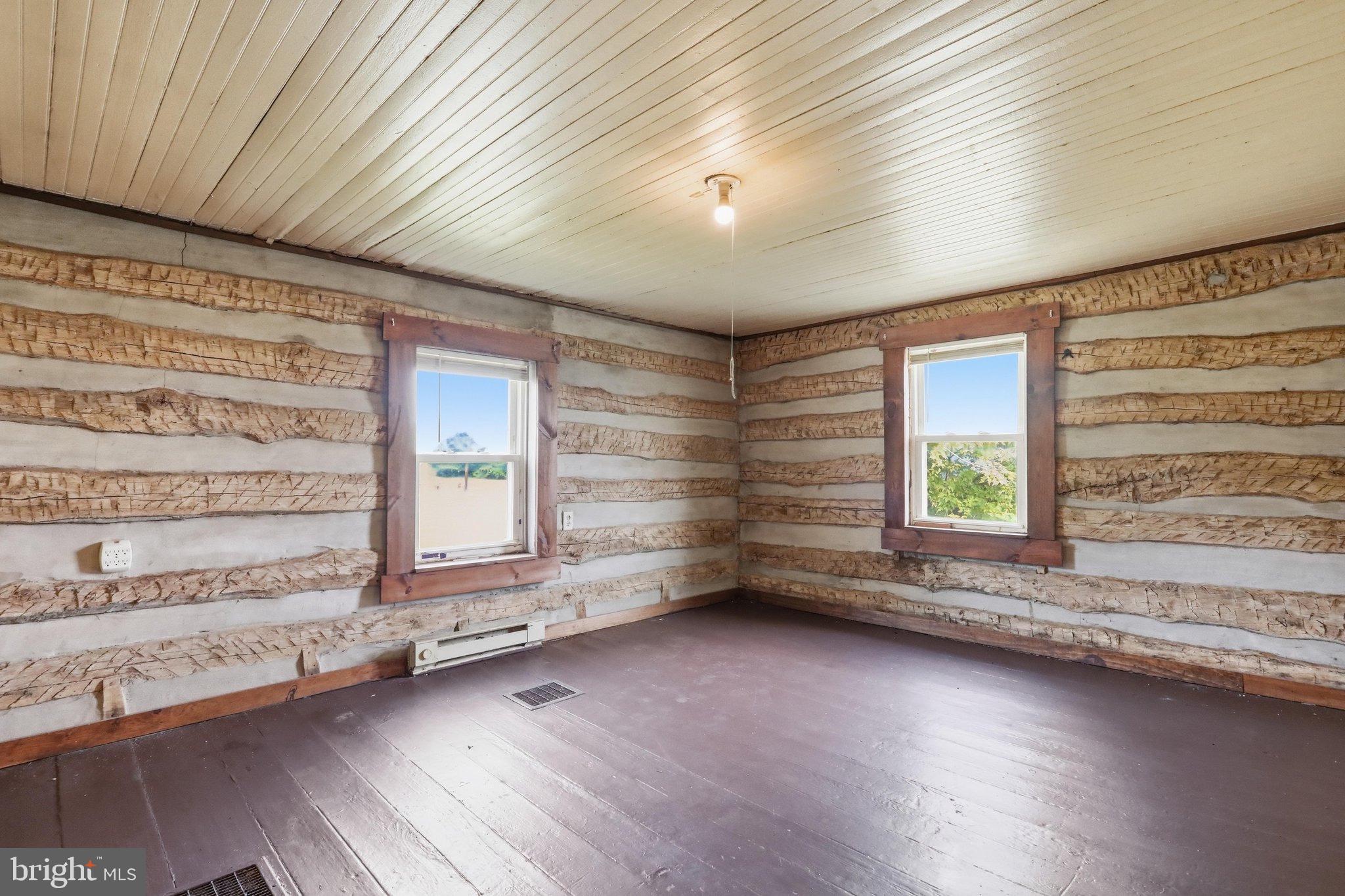 4651 Leetown Road Summit Point, WV 25446 - Photo 3 of 28 Rustic charm in a cozy log cabin space.