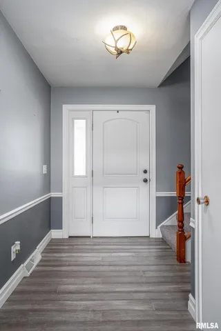a view of a room with wooden floor and closet