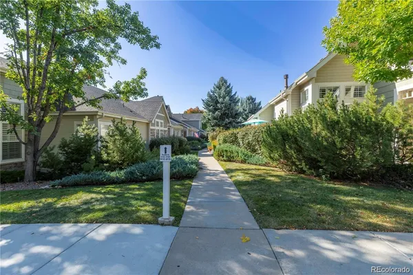 a view of a pathway with a yard