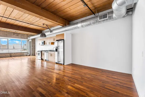 a view of a livingroom with wooden floor