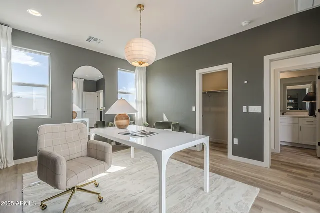 a view of a dining room with furniture window and wooden floor