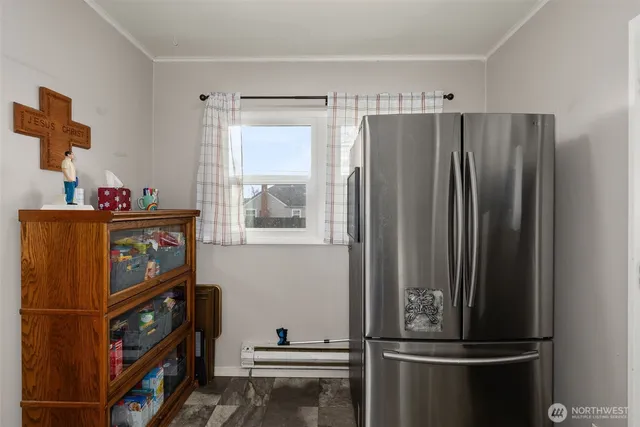 a kitchen with a refrigerator and a window