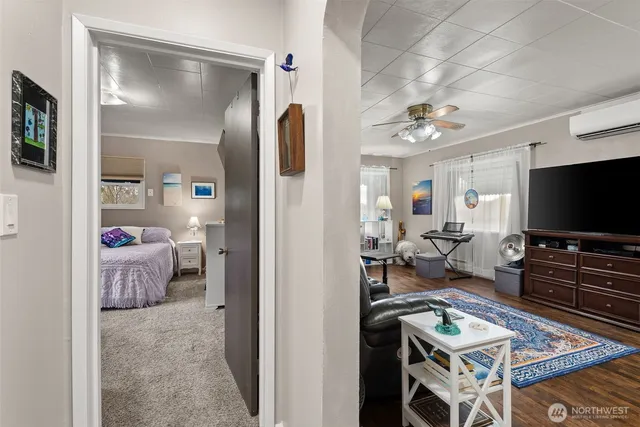 a living room with furniture and a flat screen tv