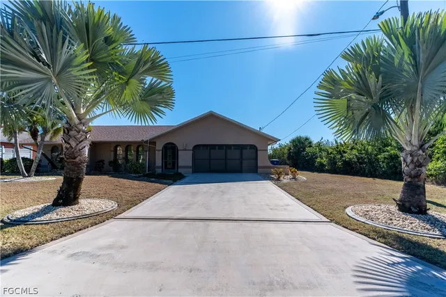 a house with palm tree in front of it