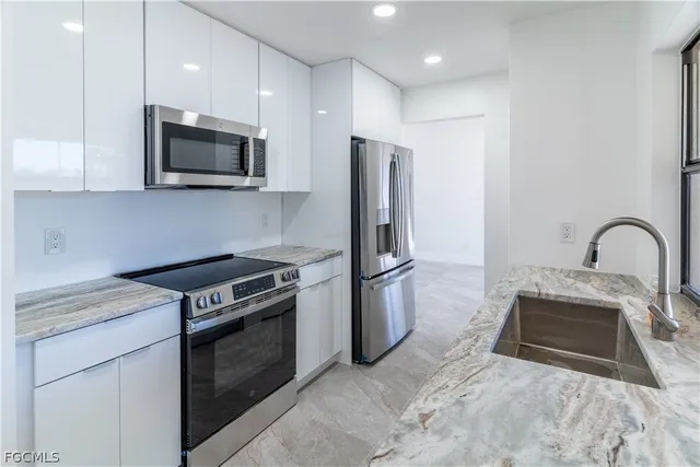 a kitchen with a stove and a microwave