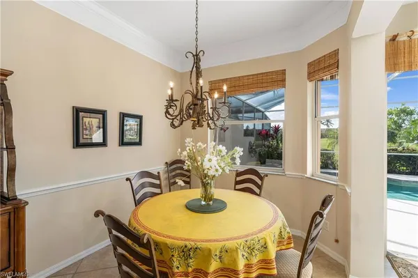 a dining room with furniture and window