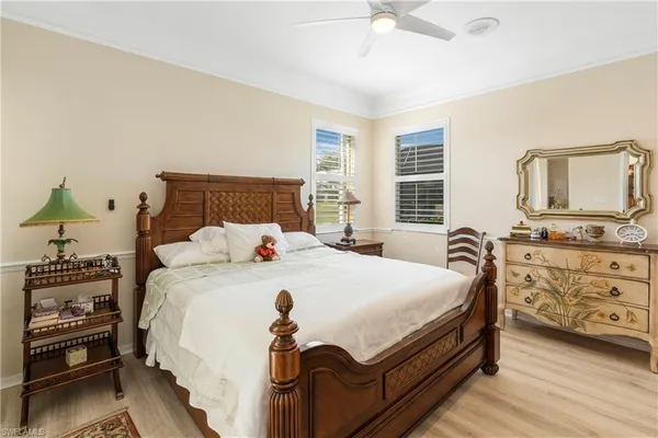 a bed room with a bed and a television