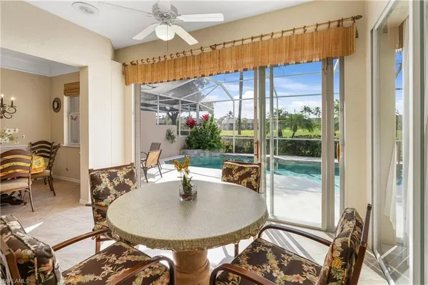 a dining room with a table and chairs