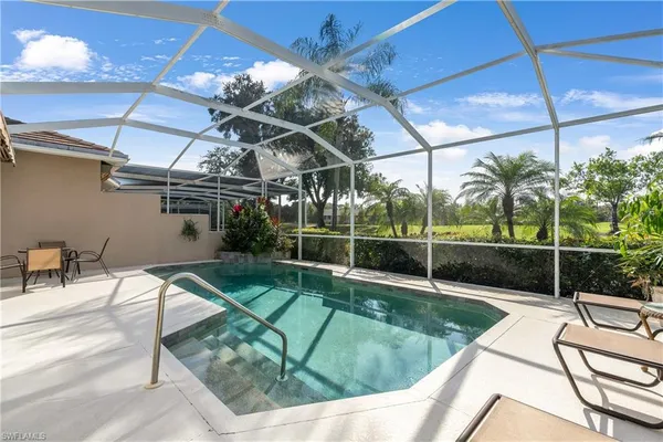 a view of a swimming pool with a patio